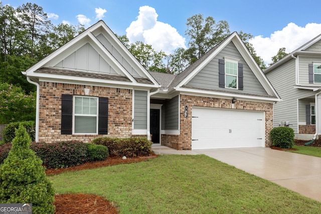 131 Prominence Ct, Canton, GA 30114 - craftsman inspired home featuring brick siding, board and batten siding, driveway, a front lawn, and a garage
