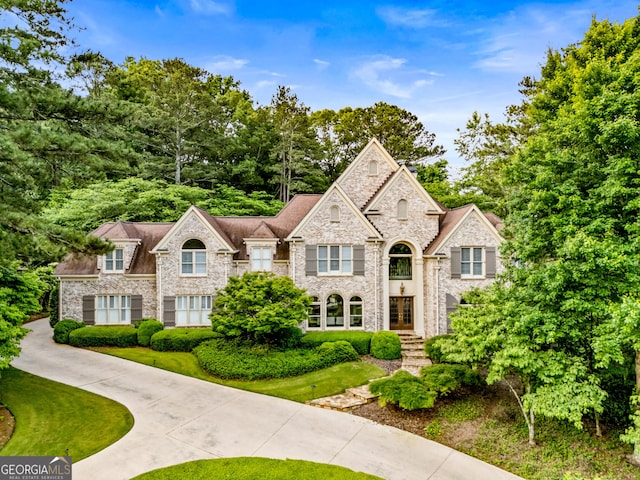 3905 Merriweather Woods, Johns Creek, GA 30022 - view of front of home featuring stone siding and french doors