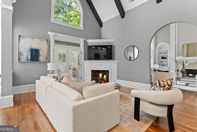 3905 Merriweather Woods, Johns Creek, GA 30022 - living area featuring a fireplace, high vaulted ceiling, plenty of natural light, baseboards, and beamed ceiling