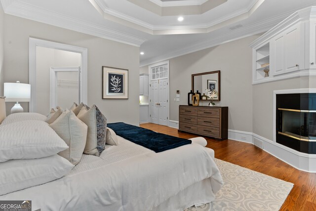 3905 Merriweather Woods, Johns Creek, GA 30022 - bedroom with crown molding, wood finished floors, recessed lighting, a tray ceiling, and a closet