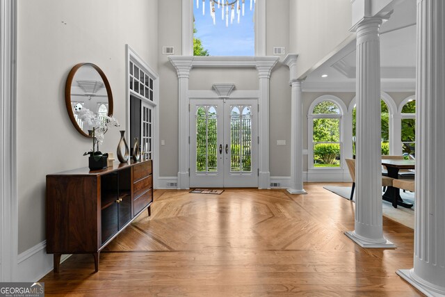 3905 Merriweather Woods, Johns Creek, GA 30022 - entryway with decorative columns, french doors, a high ceiling, and baseboards