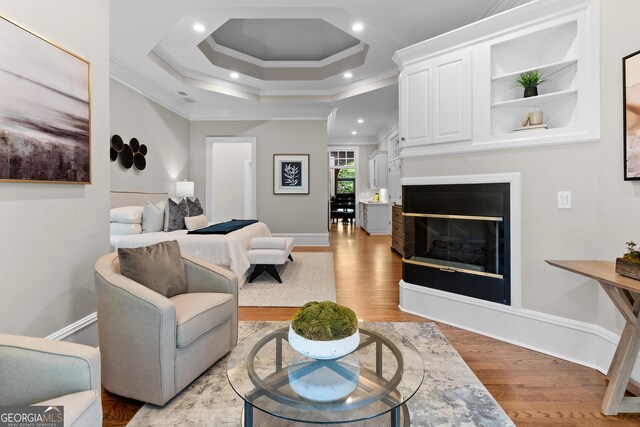 3905 Merriweather Woods, Johns Creek, GA 30022 - living room with ornamental molding, baseboards, light wood finished floors, a glass covered fireplace, and recessed lighting