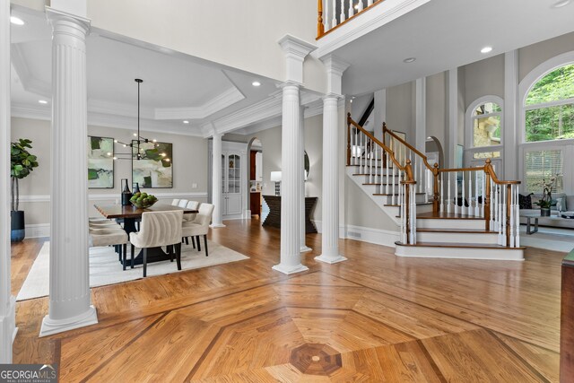 3905 Merriweather Woods, Johns Creek, GA 30022 - entrance foyer with stairway, crown molding, decorative columns, and baseboards