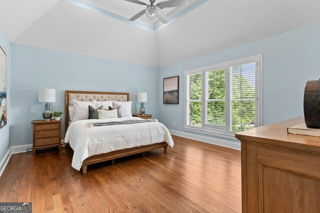 3905 Merriweather Woods, Johns Creek, GA 30022 - bedroom with wood finished floors, baseboards, a ceiling fan, lofted ceiling, and a tray ceiling