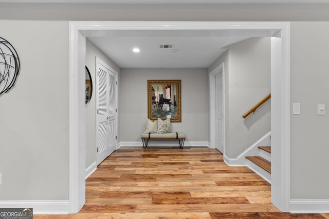 3905 Merriweather Woods, Johns Creek, GA 30022 - hallway with light wood-style flooring, stairway, recessed lighting, and baseboards