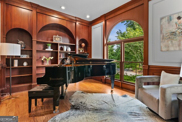 3905 Merriweather Woods, Johns Creek, GA 30022 - sitting room with a decorative wall, wood finished floors, and wood walls