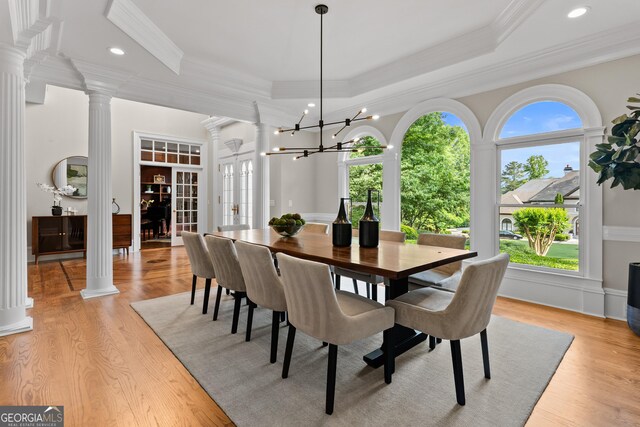 3905 Merriweather Woods, Johns Creek, GA 30022 - dining area with ornamental molding, ornate columns, light wood-type flooring, french doors, and a raised ceiling