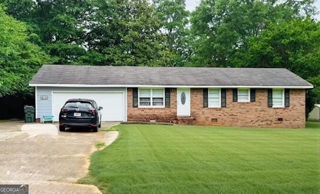 123 Hillview Dr, Thomaston, GA 30286 - ranch-style home featuring concrete driveway, crawl space, an attached garage, a front lawn, and brick siding