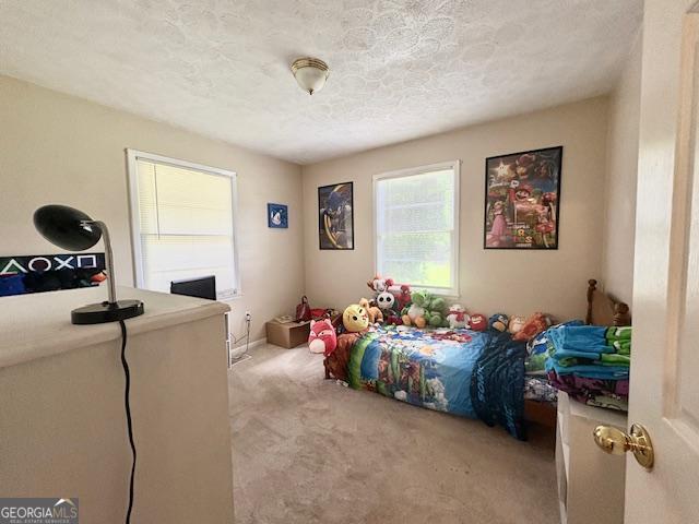 123 Hillview Dr, Thomaston, GA 30286 - bedroom with carpet and a textured ceiling