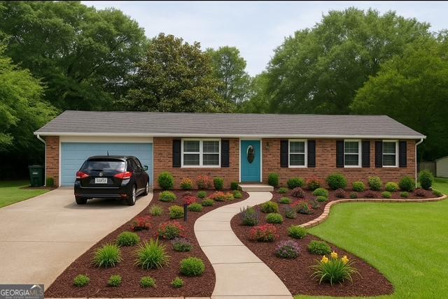 123 Hillview Dr, Thomaston, GA 30286 - ranch-style home featuring brick siding, driveway, a front lawn, and a garage