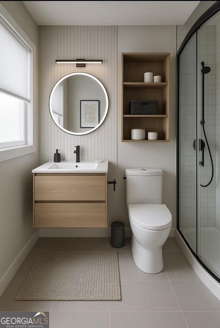 123 Hillview Dr, Thomaston, GA 30286 - bathroom featuring a stall shower, vanity, tile patterned floors, and toilet