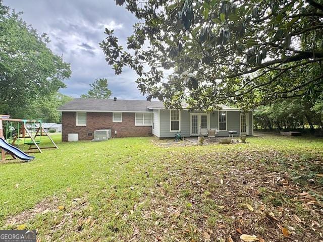 123 Hillview Dr, Thomaston, GA 30286 - rear view of property with french doors, a playground, and a yard