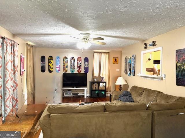 123 Hillview Dr, Thomaston, GA 30286 - living area with a ceiling fan, a textured ceiling, and wood finished floors