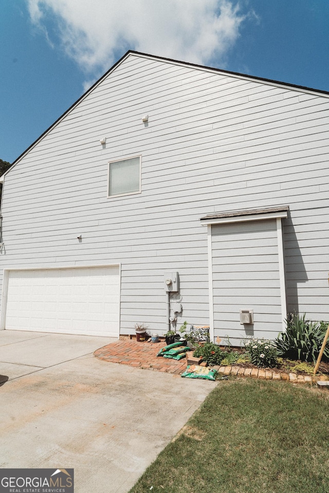 258 Creek View Ln, Acworth, GA 30102 - view of home's exterior with an attached garage and concrete driveway