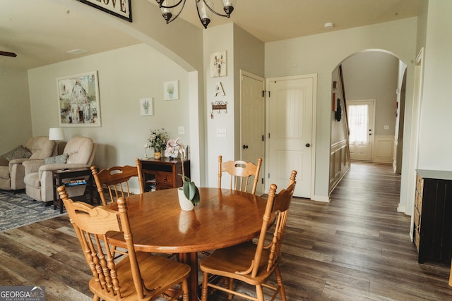258 Creek View Ln, Acworth, GA 30102 - dining room with arched walkways, dark wood-type flooring, and a chandelier