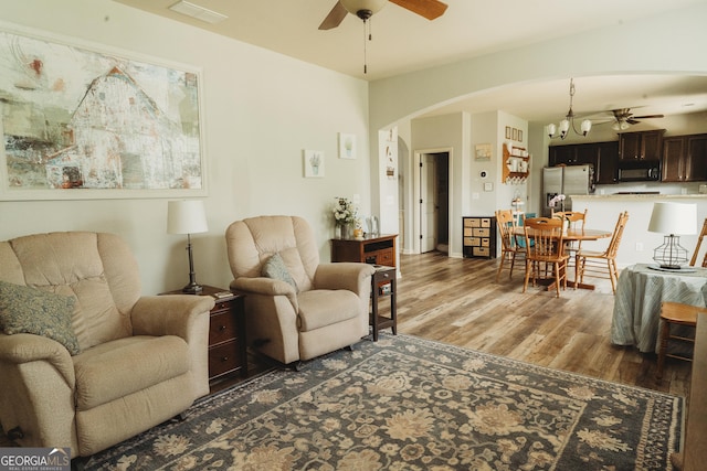 258 Creek View Ln, Acworth, GA 30102 - living area with ceiling fan, arched walkways, and wood finished floors