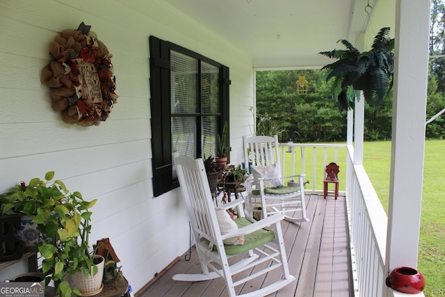 124 Wynn Rd, Mcdonough, GA 30252 - wooden terrace with covered porch and a lawn