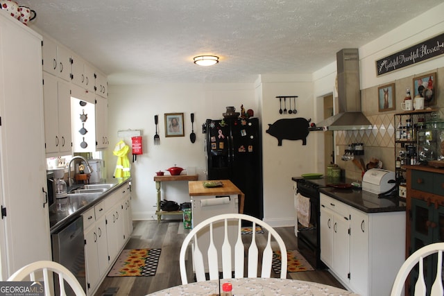 124 Wynn Rd, Mcdonough, GA 30252 - kitchen with wall chimney exhaust hood, a sink, black appliances, white cabinetry, and dark wood-type flooring