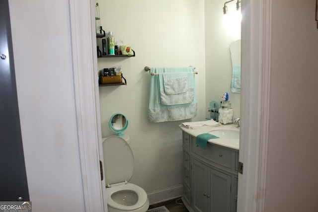 124 Wynn Rd, Mcdonough, GA 30252 - bathroom featuring vanity, toilet, and baseboards