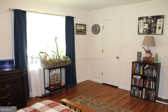 124 Wynn Rd, Mcdonough, GA 30252 - living area with dark wood-type flooring and baseboards