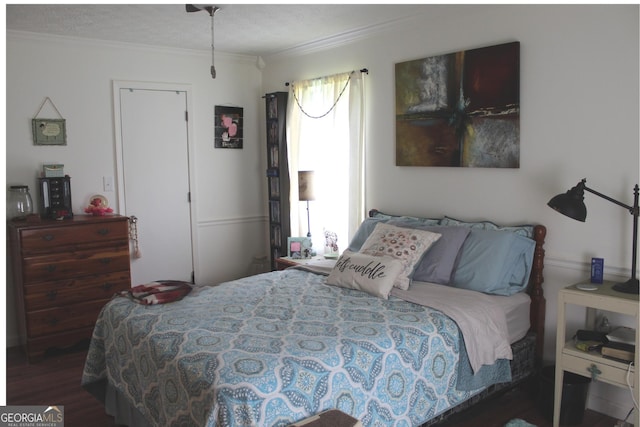 124 Wynn Rd, Mcdonough, GA 30252 - bedroom featuring crown molding, wood finished floors, and a textured ceiling
