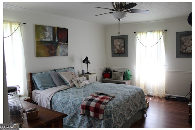 124 Wynn Rd, Mcdonough, GA 30252 - bedroom with wood finished floors, ornamental molding, and a ceiling fan