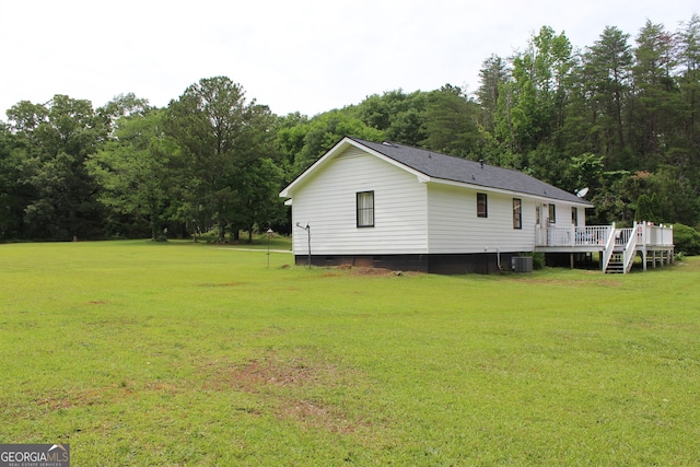 124 Wynn Rd, Mcdonough, GA 30252 - view of home's exterior with a wooden deck, a yard, central AC, and crawl space