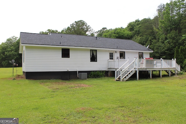 124 Wynn Rd, Mcdonough, GA 30252 - rear view of house with a lawn, a deck, stairway, and roof with shingles
