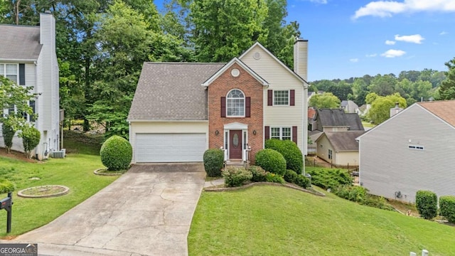 4305 Chesapeake Trce, Acworth, GA 30101 - colonial home with brick siding, concrete driveway, a front yard, a chimney, and an attached garage