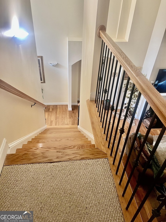 5430 Lemoyne Dr SW, South Fulton, GA 30331 - staircase with wood finished floors and baseboards