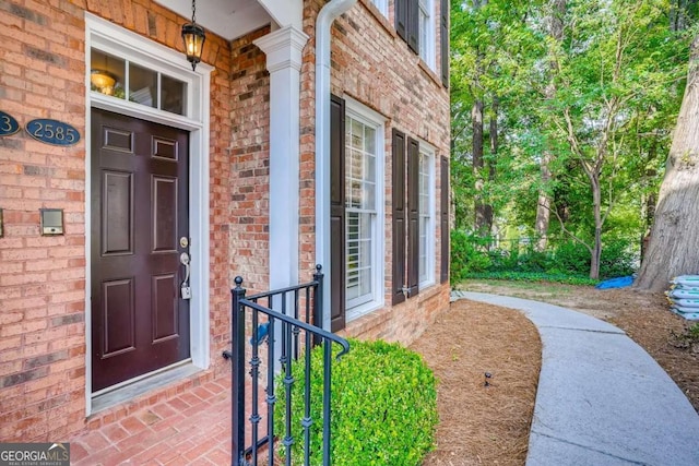 entrance to property with brick siding