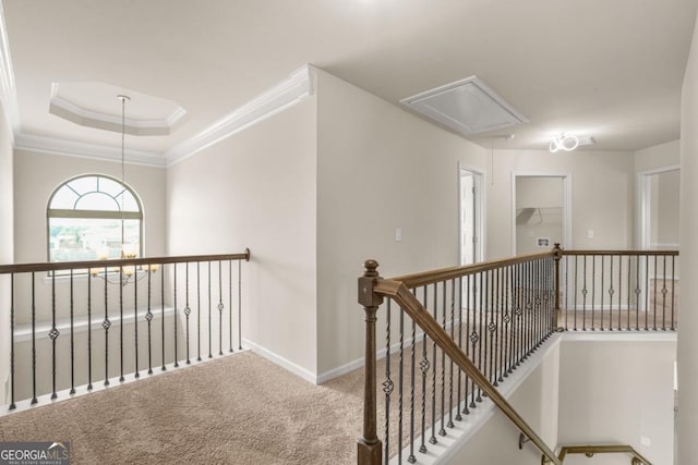 321 Shannon Ct, Mcdonough, GA 30252 - corridor featuring attic access, an upstairs landing, baseboards, carpet flooring, and ornamental molding