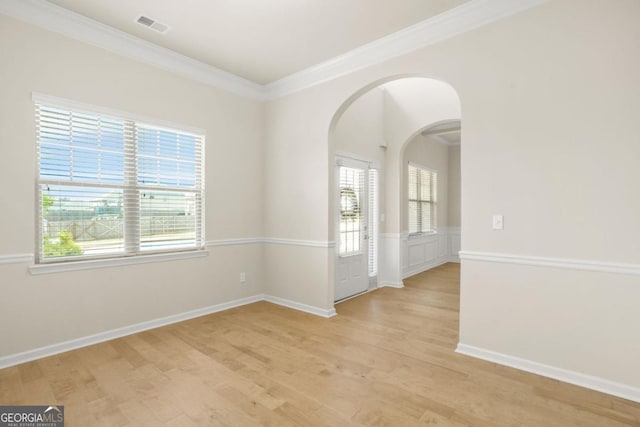 321 Shannon Ct, Mcdonough, GA 30252 - unfurnished room with arched walkways, light wood-type flooring, crown molding, and baseboards