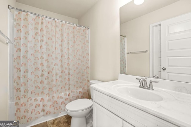 321 Shannon Ct, Mcdonough, GA 30252 - bathroom with toilet, vanity, and a shower with shower curtain