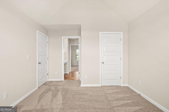321 Shannon Ct, Mcdonough, GA 30252 - unfurnished bedroom with carpet flooring, lofted ceiling, and baseboards