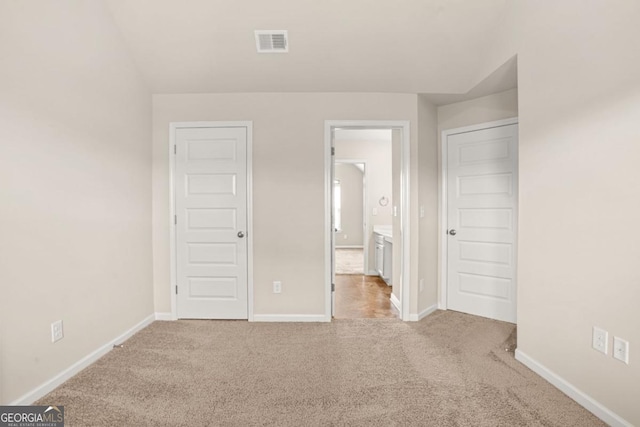 321 Shannon Ct, Mcdonough, GA 30252 - unfurnished bedroom featuring light carpet and baseboards