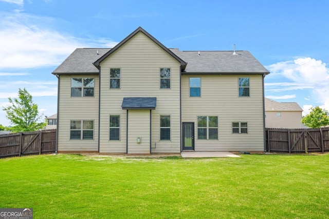 321 Shannon Ct, Mcdonough, GA 30252 - back of property with a patio, a gate, and a shingled roof