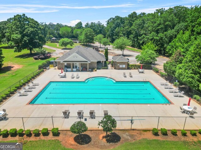 321 Shannon Ct, Mcdonough, GA 30252 - community pool with a patio and view of wooded area