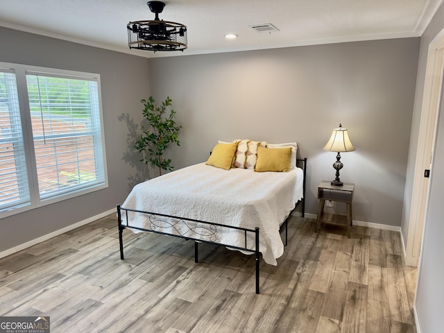 2093 Double Bridge Rd, Demorest, GA 30535 - bedroom featuring light wood-style floors, crown molding, and baseboards