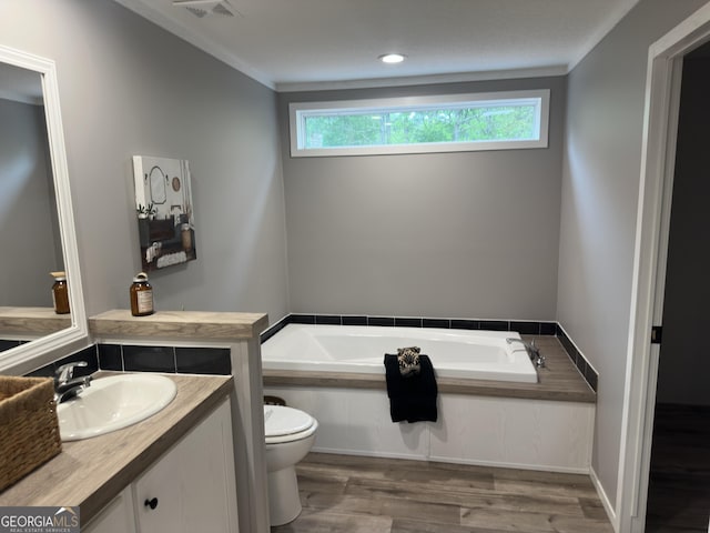 2093 Double Bridge Rd, Demorest, GA 30535 - bathroom featuring a garden tub, wood finished floors, vanity, and toilet