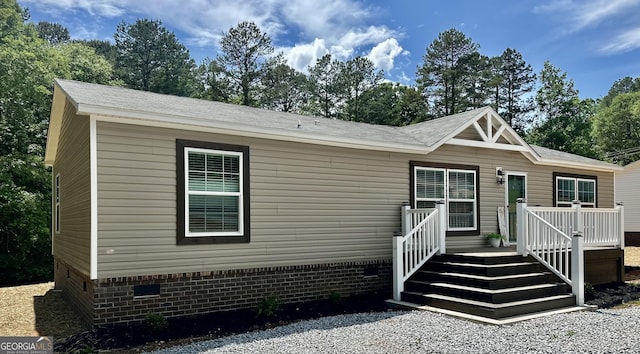 manufactured / mobile home featuring crawl space and a deck