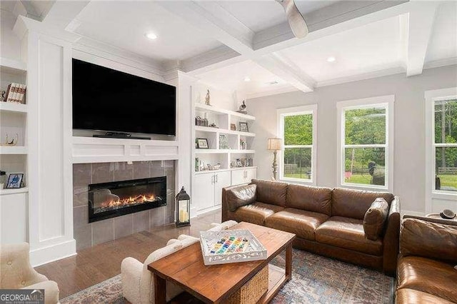 1660 Chandler Rd, Lawrenceville, GA 30045 - living area featuring wood finished floors, a tiled fireplace, beam ceiling, built in shelves, and coffered ceiling
