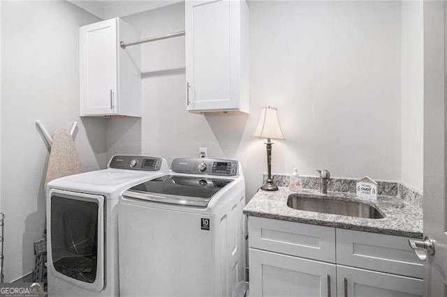 1660 Chandler Rd, Lawrenceville, GA 30045 - washroom featuring cabinet space and washer and clothes dryer