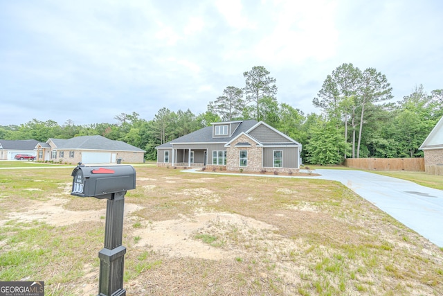 view of front of home with covered porch and concrete driveway