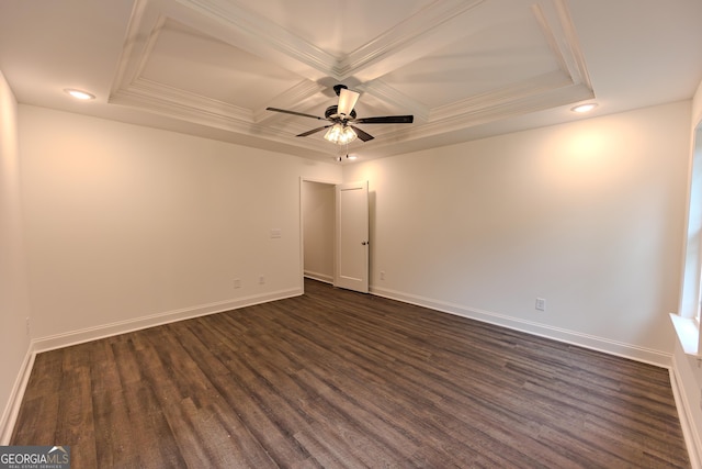 spare room with dark wood-type flooring, coffered ceiling, ceiling fan, recessed lighting, and ornamental molding
