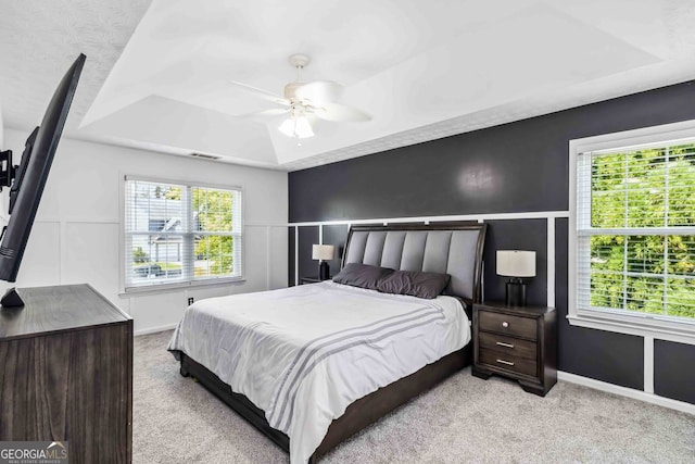 870 Underhill Ct, Sugar Hill, GA 30518 - bedroom with a tray ceiling, carpet flooring, ceiling fan, and baseboards