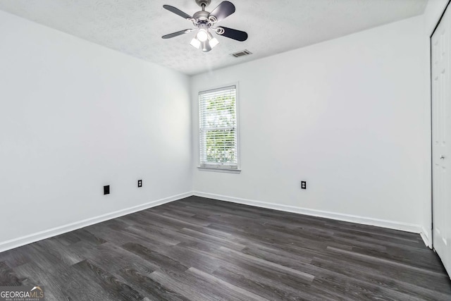 870 Underhill Ct, Sugar Hill, GA 30518 - unfurnished room with dark wood finished floors, ceiling fan, baseboards, and a textured ceiling