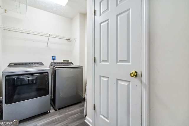 870 Underhill Ct, Sugar Hill, GA 30518 - laundry room with separate washer and dryer and wood finished floors