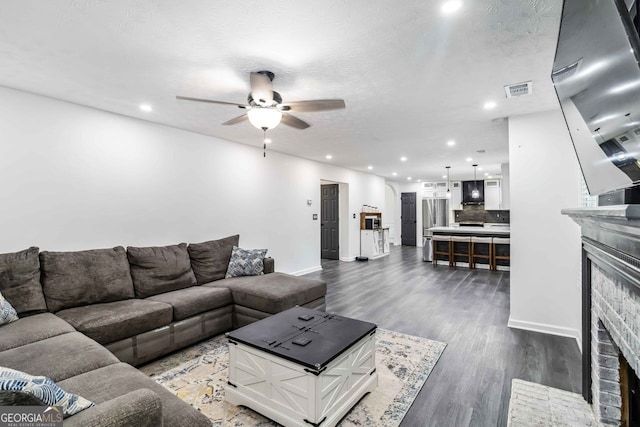 870 Underhill Ct, Sugar Hill, GA 30518 - living room featuring a fireplace, a ceiling fan, dark wood-style floors, recessed lighting, and baseboards