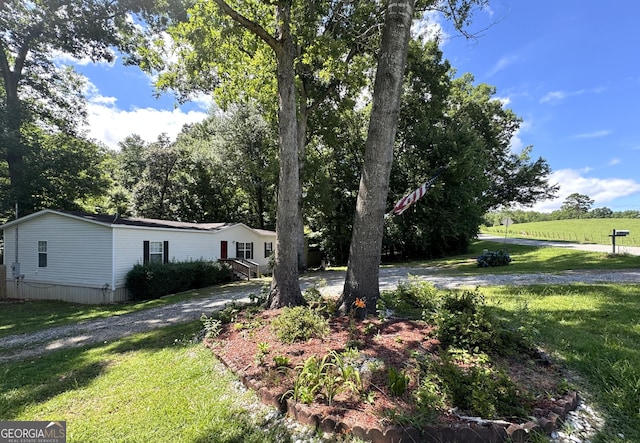 view of front of property with a front lawn and driveway